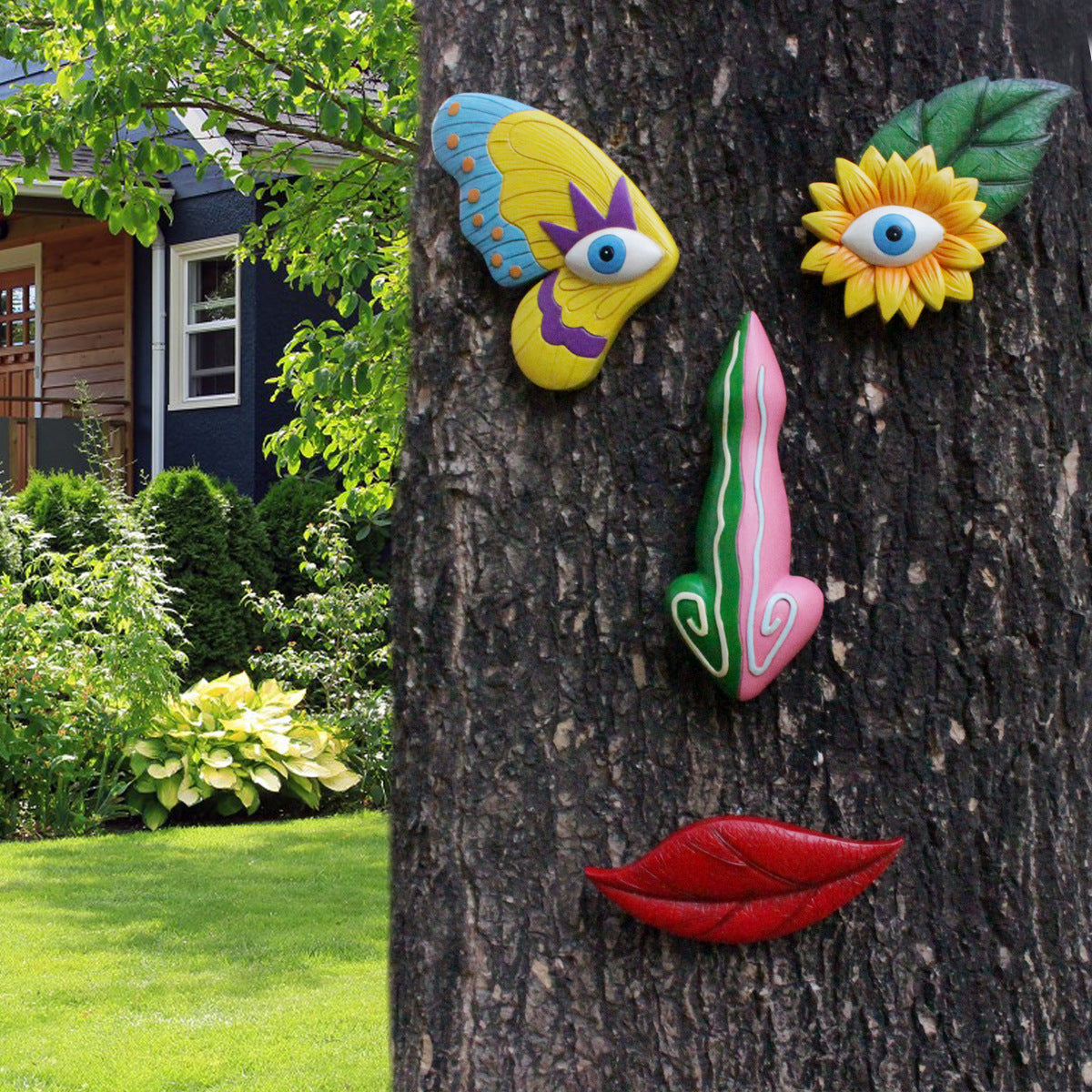 Colorful resin face art wall decor: blue-yellow eye mask, pink nose, red lips.