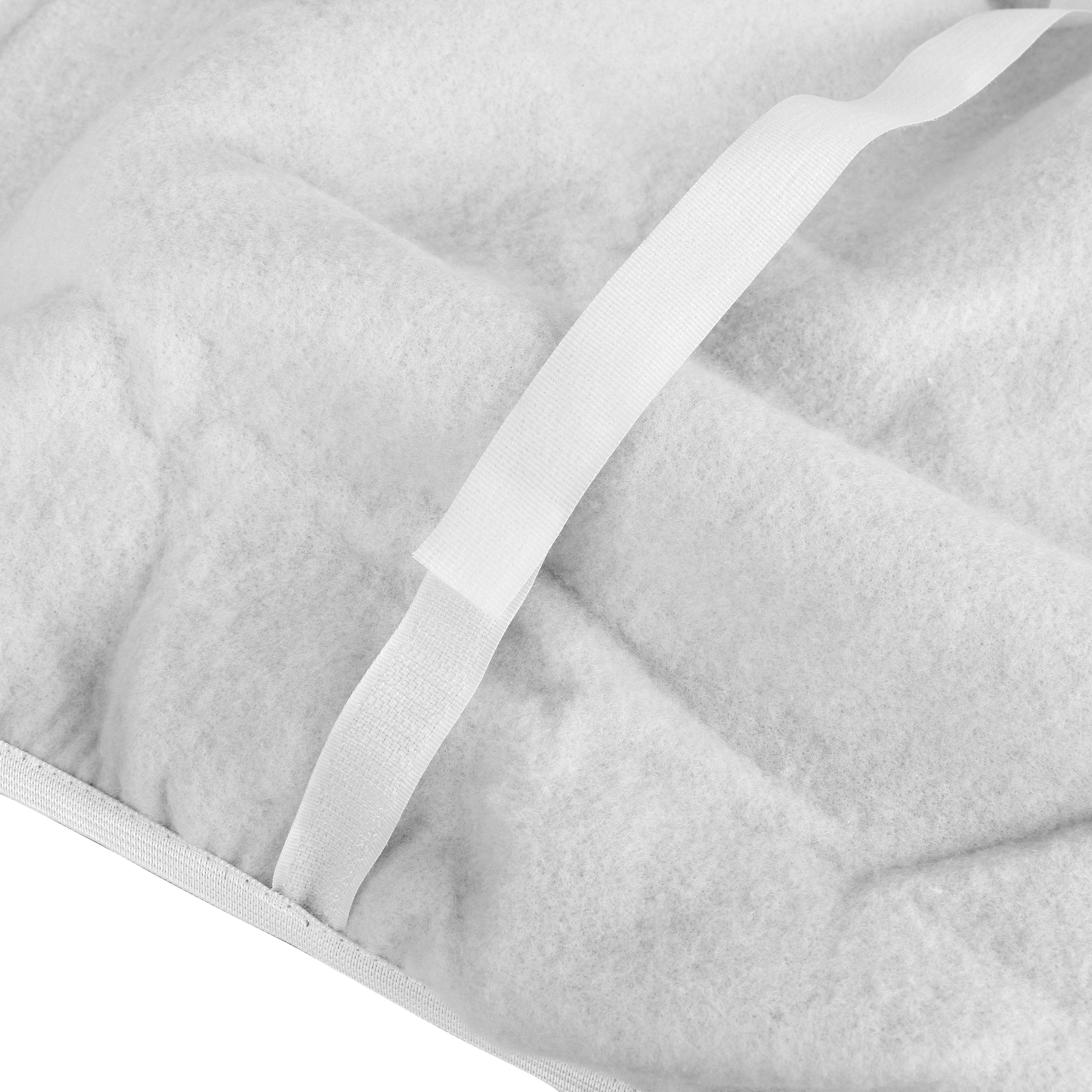 Ironing board cover with white strap and textured fabric, seam detail