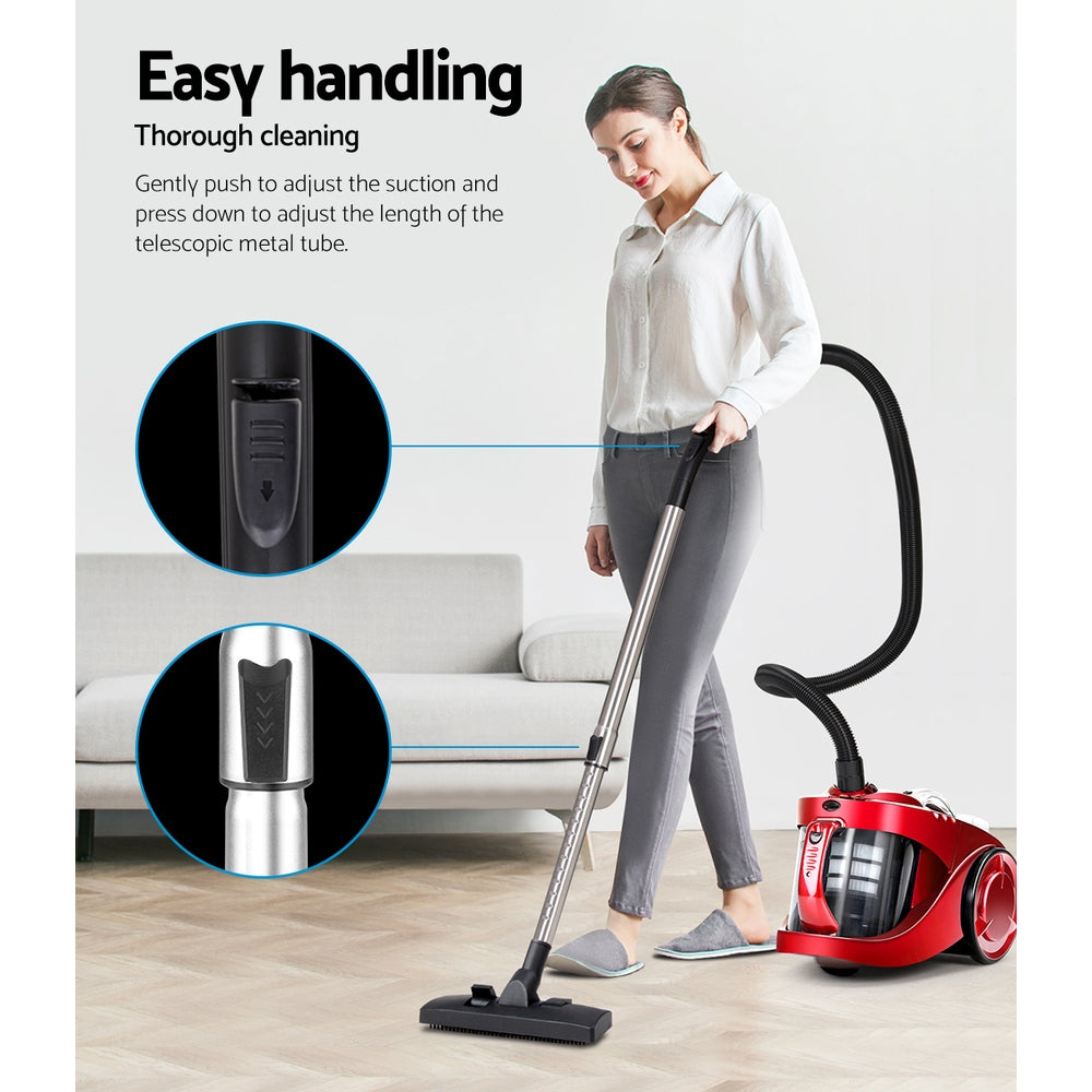 Red bagless vacuum cleaner with telescopic wand and floor nozzle, ready to use
