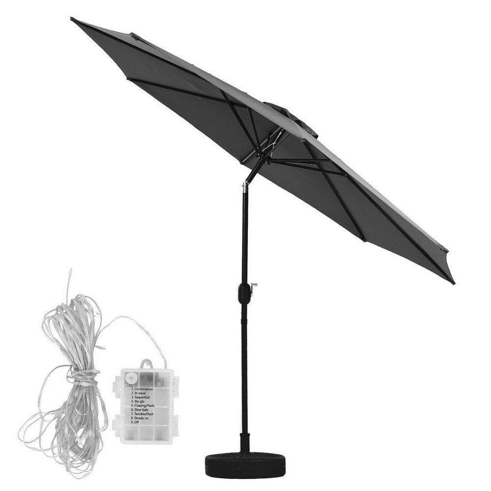 Charcoal market umbrella with side-view canopy tilt and LED string lights