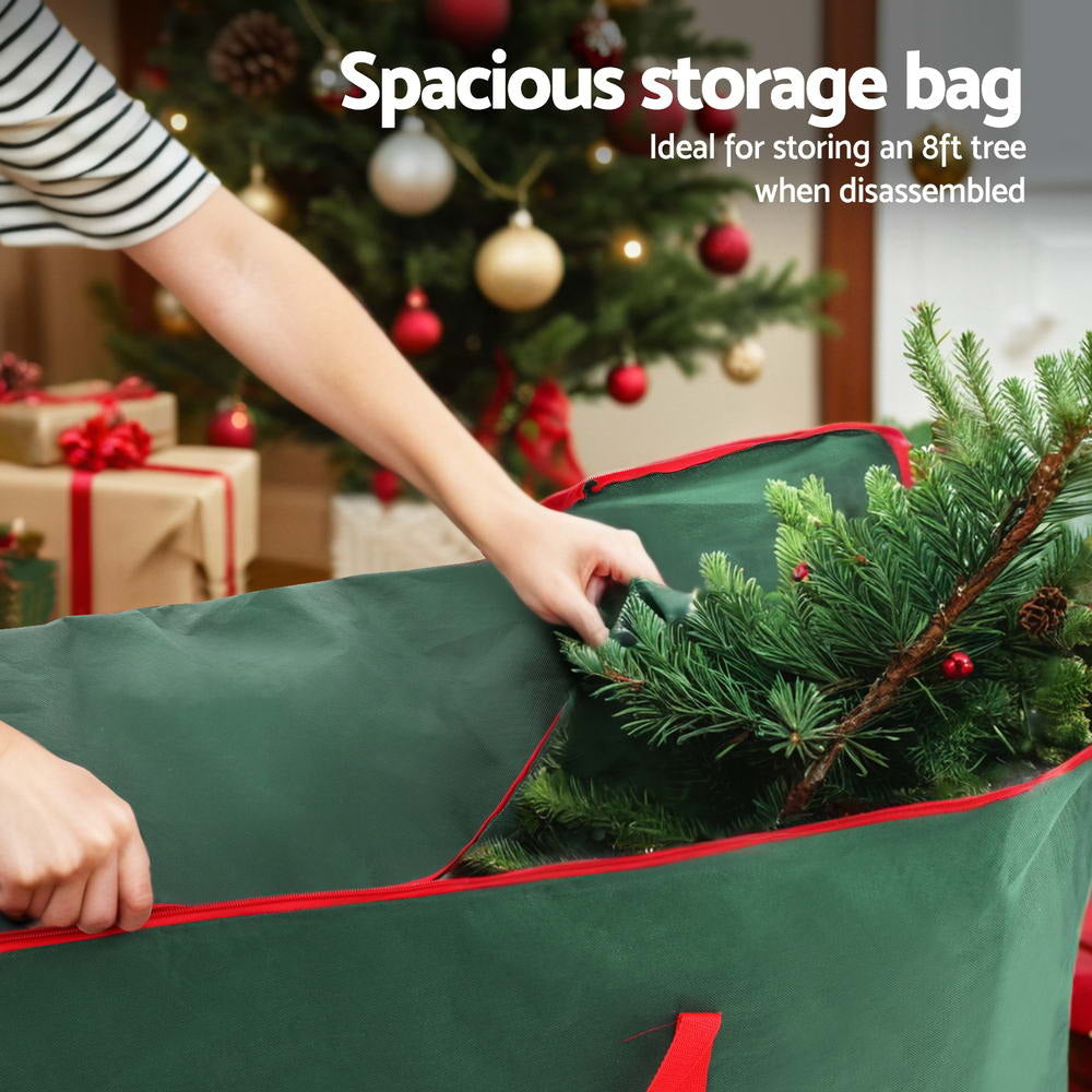 Green storage bag being opened to place a Christmas tree inside