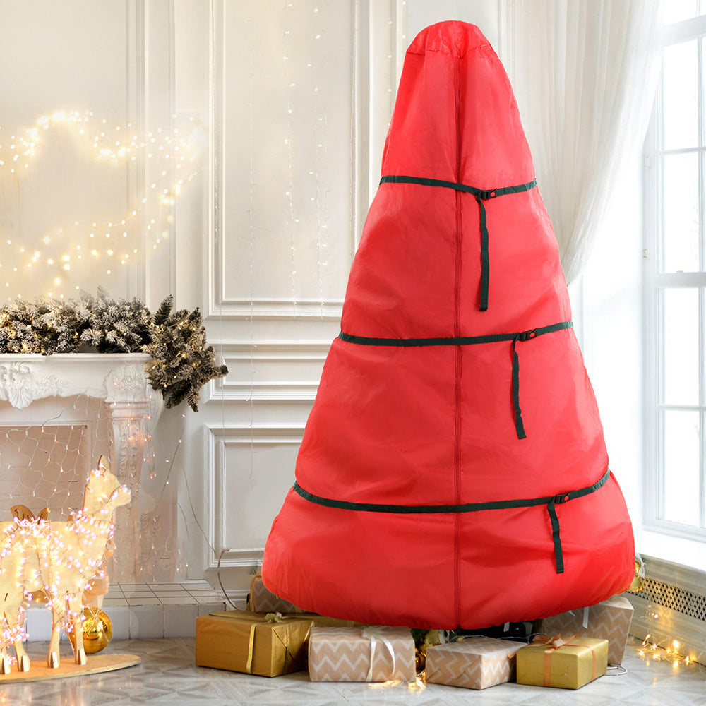 Red Christmas tree storage bag with black strap bands and base support legs visible.