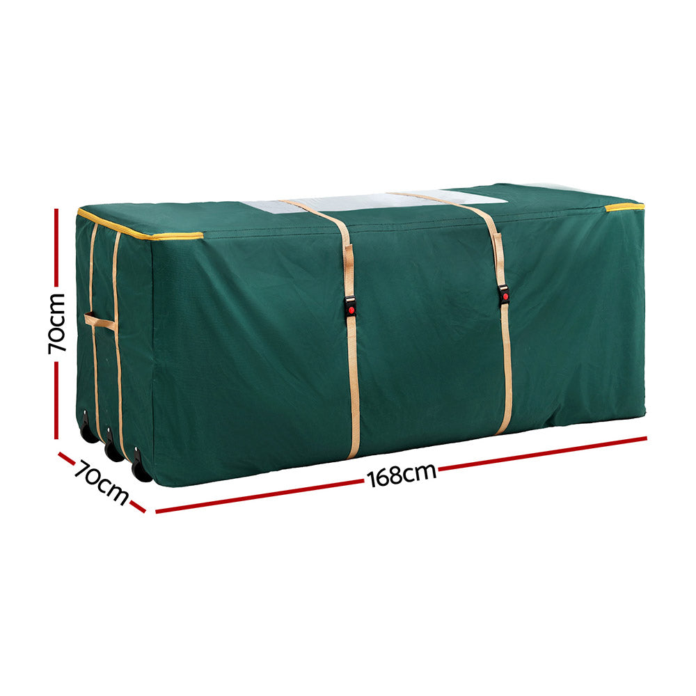 Green tree storage bag with front straps, visible handle, and corner wheels.
