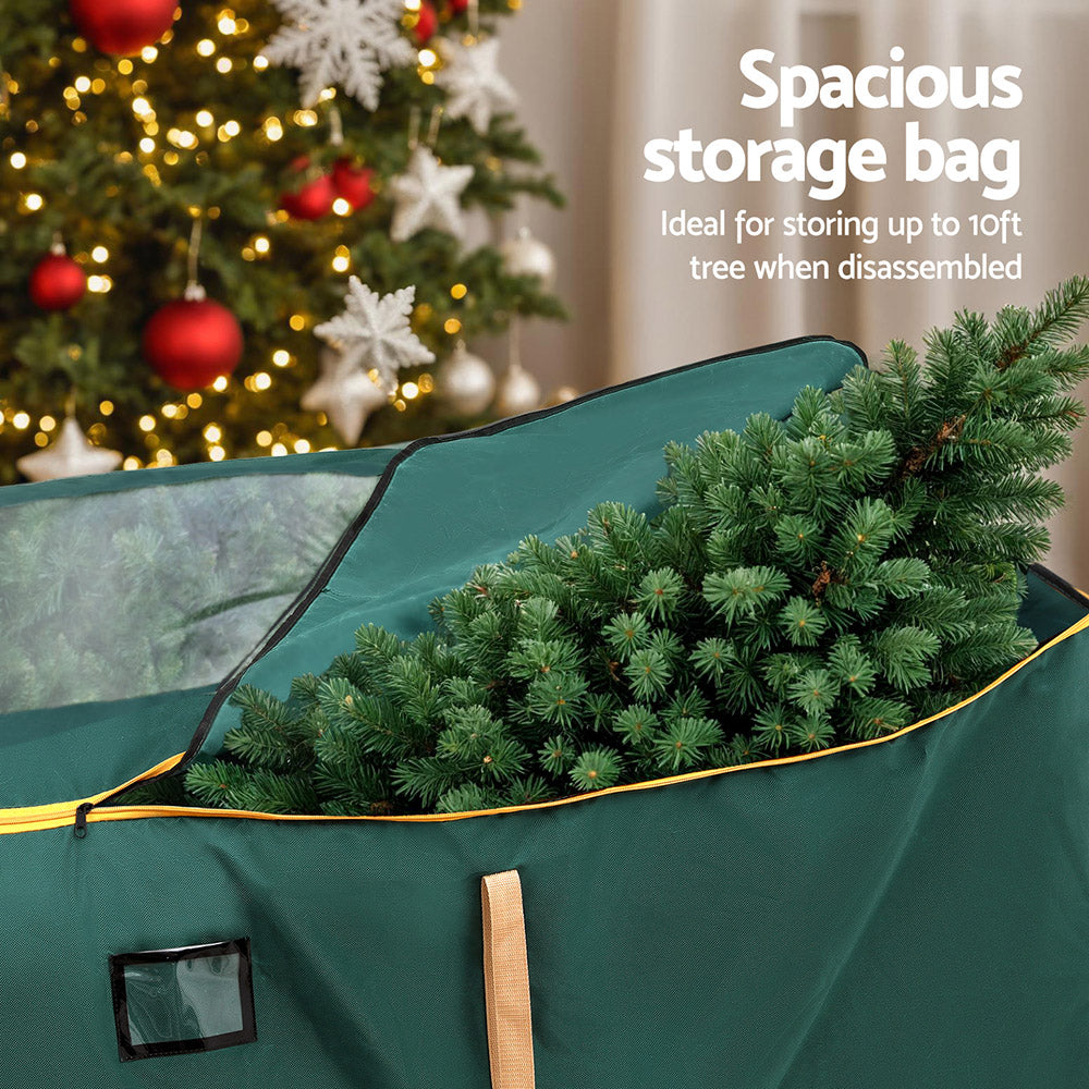 Green storage bag with clear window panel and zipper opening for a disassembled tree.