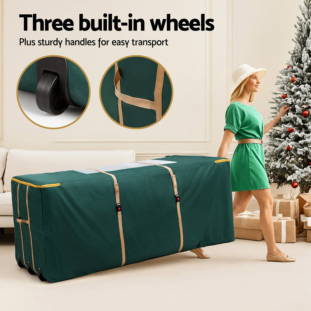 Green tree storage bag with three built-in wheels and sturdy side carry handles.