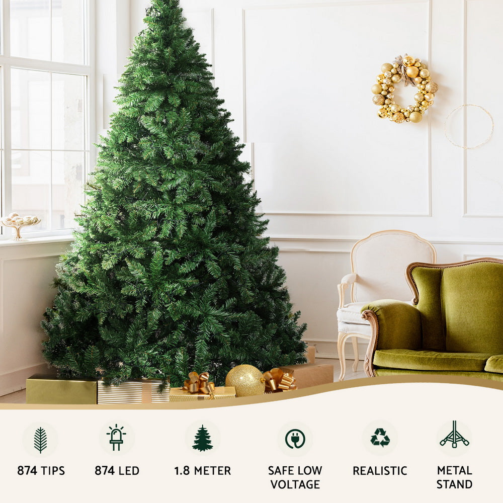 LED pre-lit Christmas tree with dark green branches and warm yellow lights, metal stand