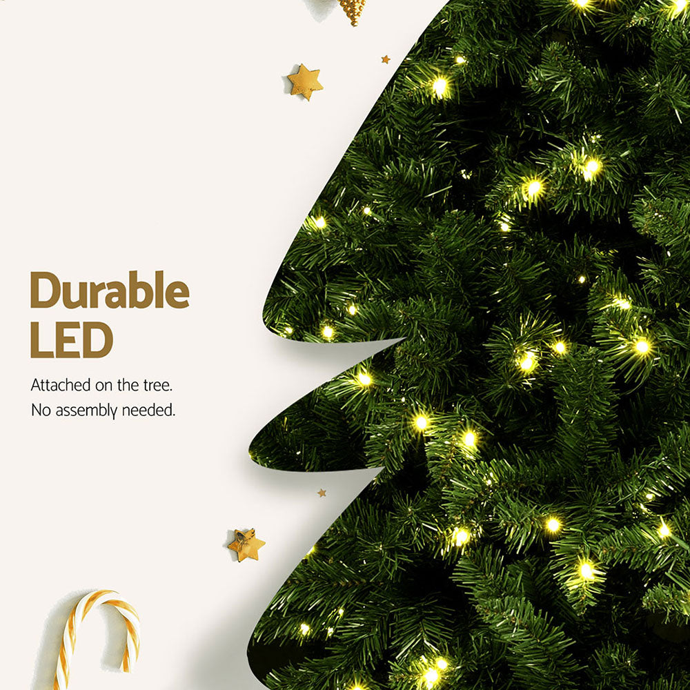 Artificial Christmas tree with warm yellow LED lights and star-shaped ornaments