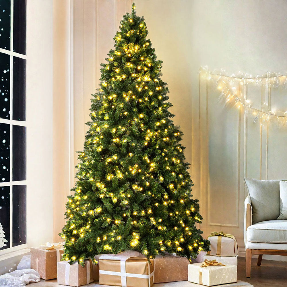 Prelit artificial Christmas tree with warm yellow LED lights in a full conical shape