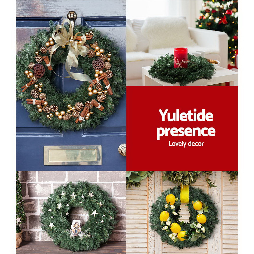 Christmas wreath decoration with pine foliage, warm gold lights, and holiday baubles