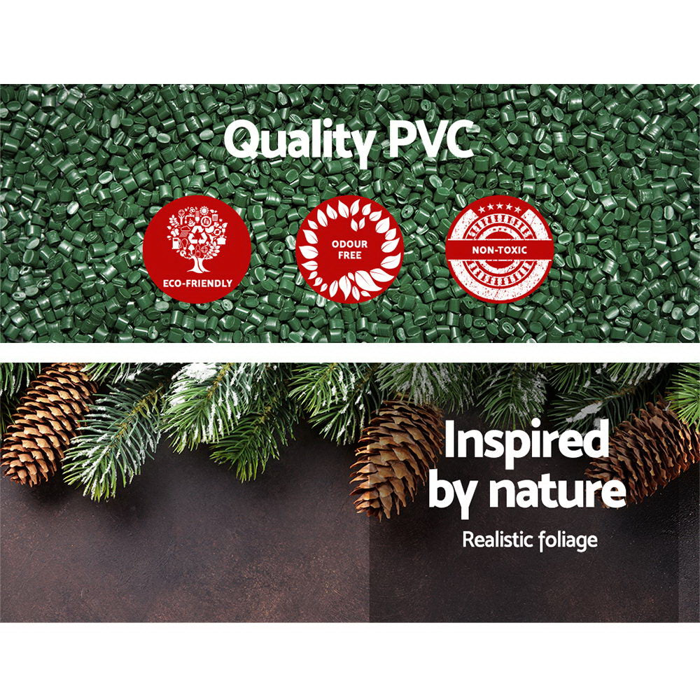 Green artificial wreath foliage close-up with textured plastic pine tips