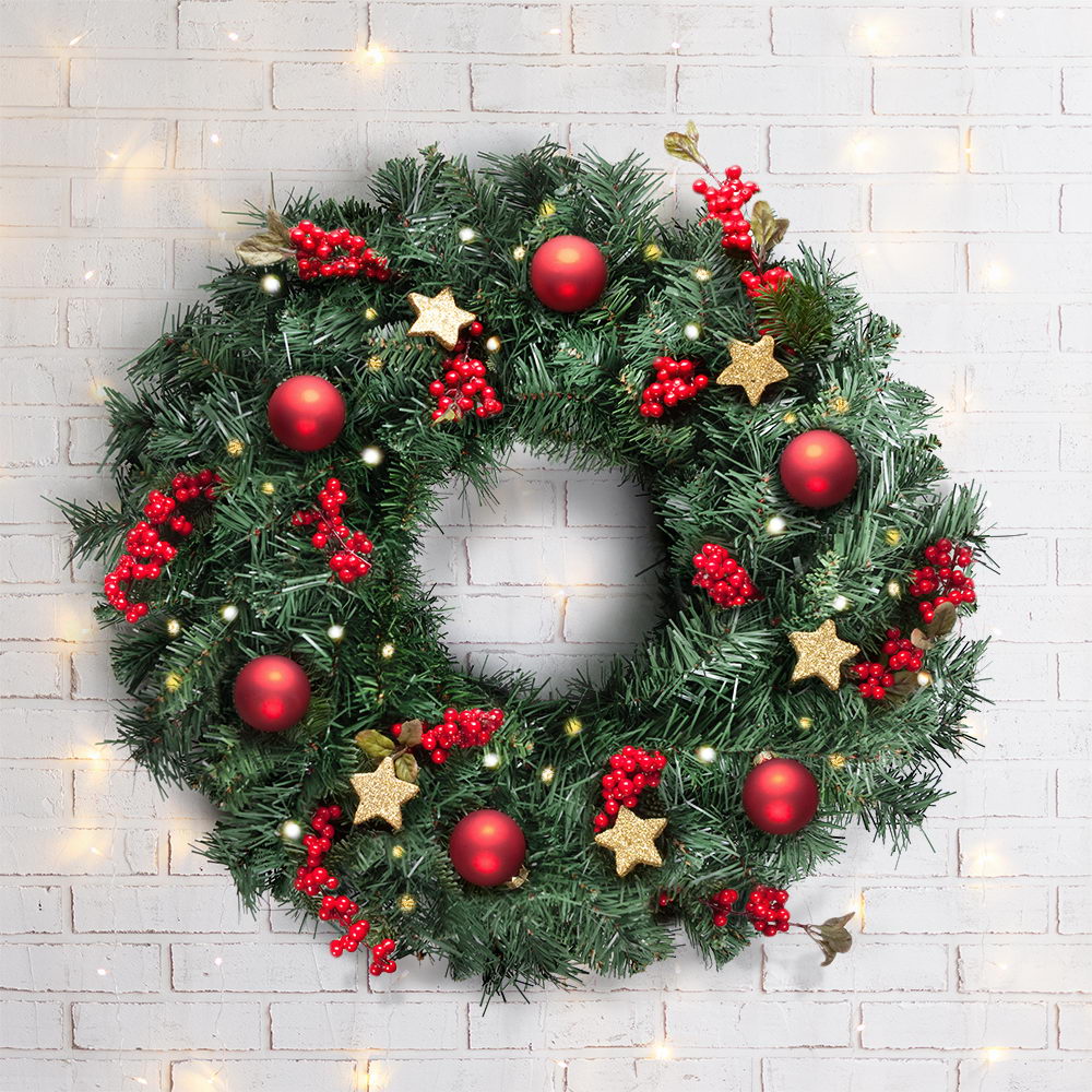 Decorated Christmas wreath with red baubles, star ornaments, and soft white lights