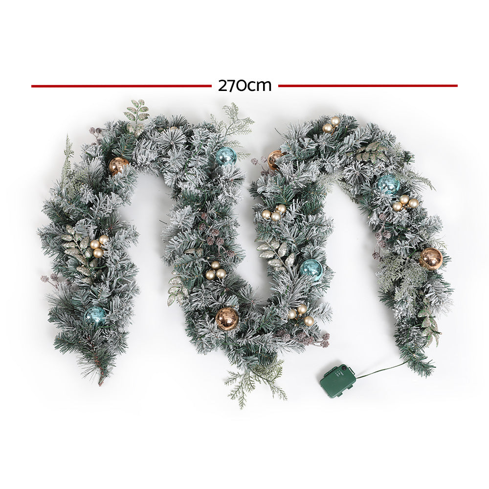Snowy flocked Christmas garland set with LED lights, blue and gold ornaments, 270cm