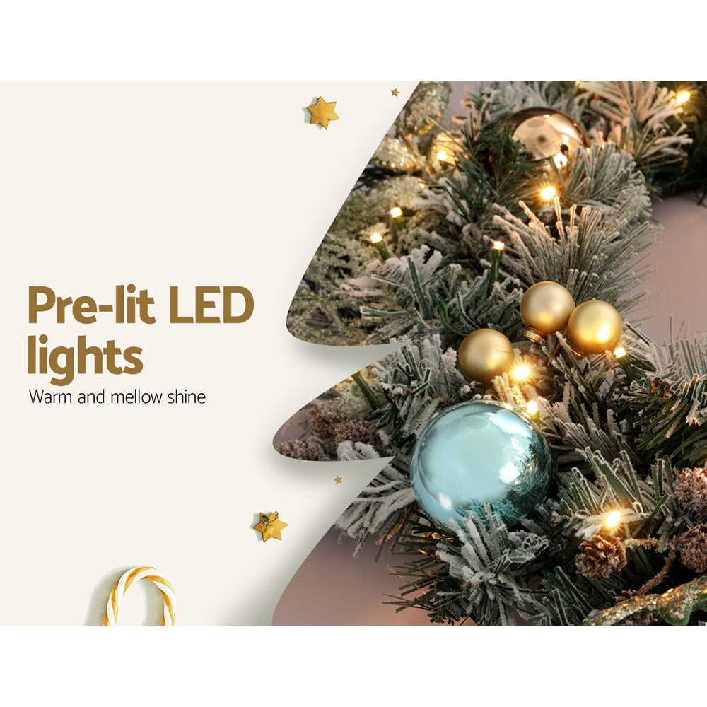 Pre-lit Christmas garland branch with warm LED lights and gold and blue baubles