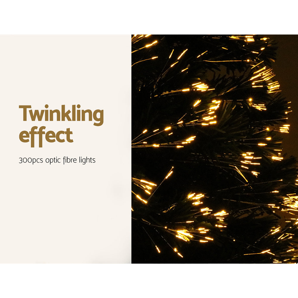 Twinkling optic fibre LED lights on a green Christmas tree