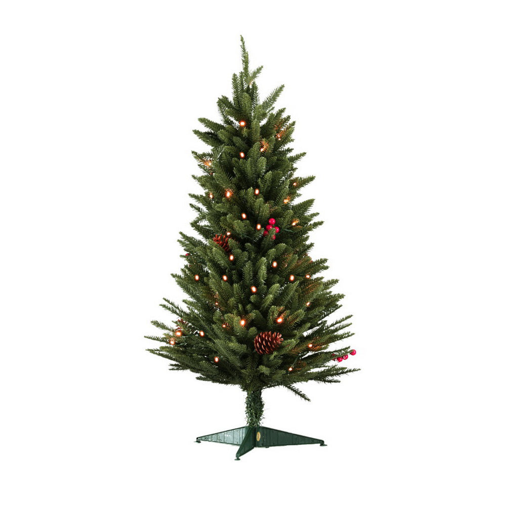 Mini Christmas tree, dense green branches with warm LED lights and pinecone berry decorations