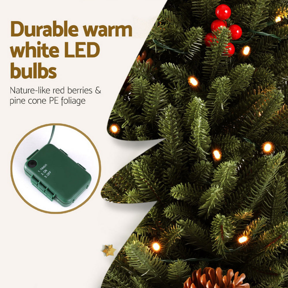 Mini Christmas tree branches with warm white LED bulbs and red berry pinecone accents