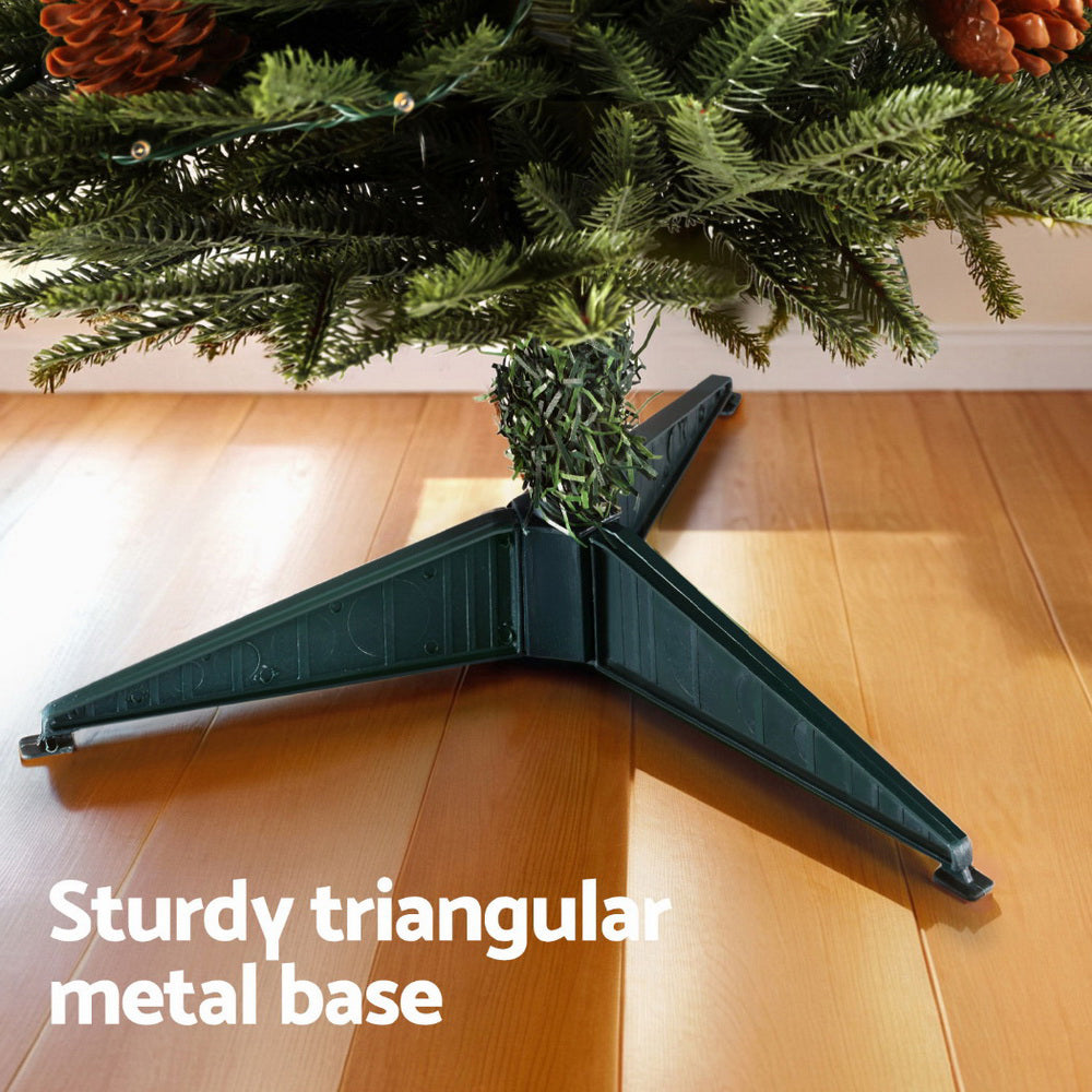 Mini Christmas tree with green needles and sturdy triangular metal stand