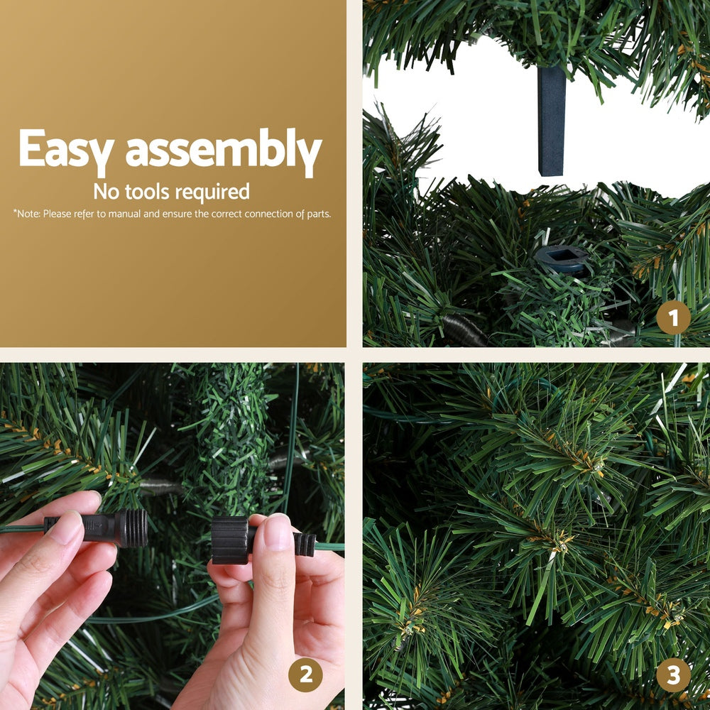 Green artificial Christmas tree with warm LED lights and power connector