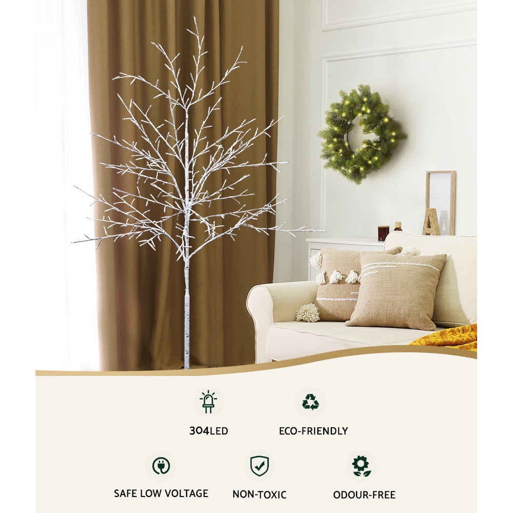 Warm white LED Christmas tree with snow-white branches and base stand
