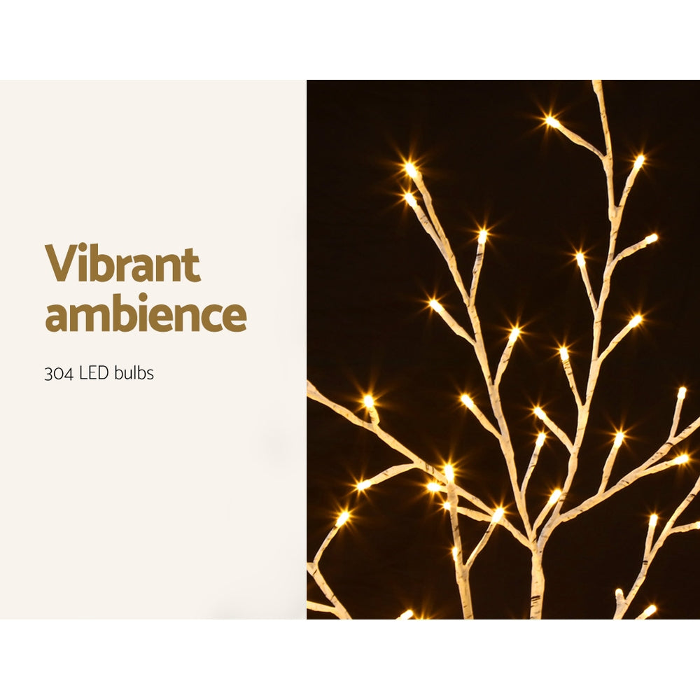 LED light Christmas tree with warm glowing branches and base stand
