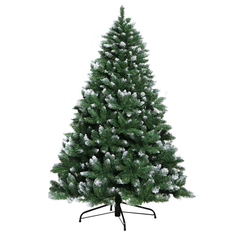 Snowy artificial Christmas tree, dark green branches with white tips and metal stand base.