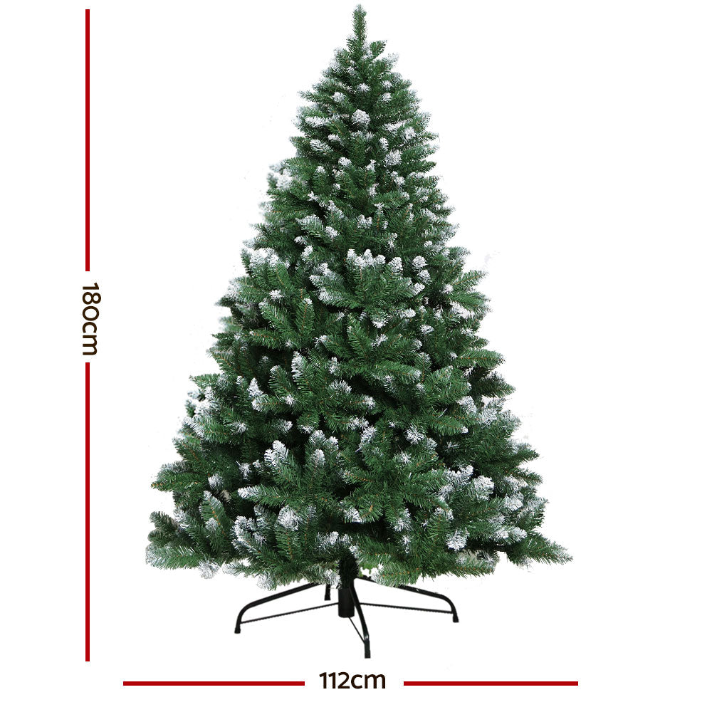 Artificial Christmas tree with white snowy tips; 180cm height and 112cm width.