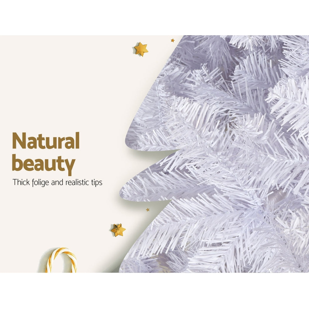 Artificial Christmas tree branch tips with dense white flocking and textured foliage