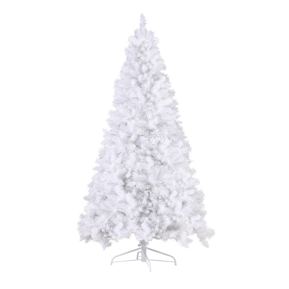 White flocked Christmas tree with warm LED lights, full silhouette on stand