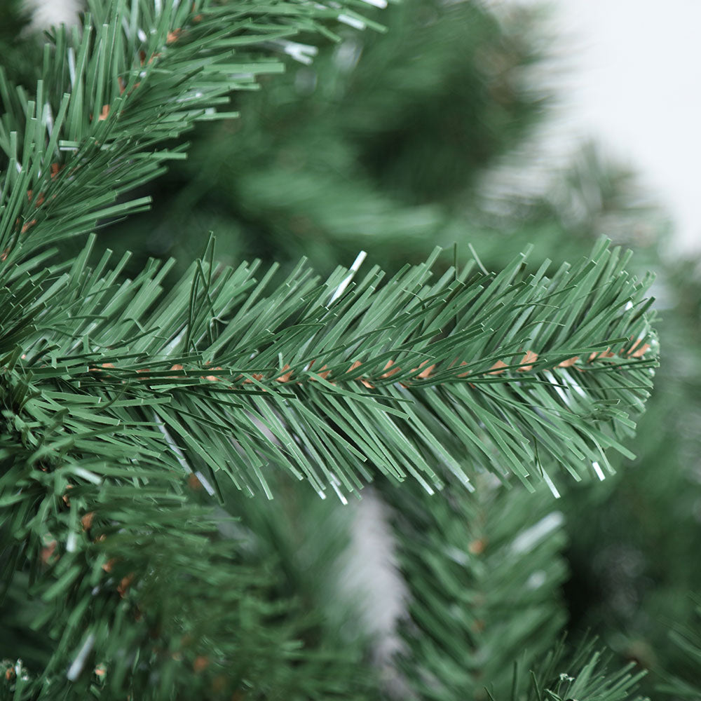 Close-up of green artificial Christmas tree branch tips