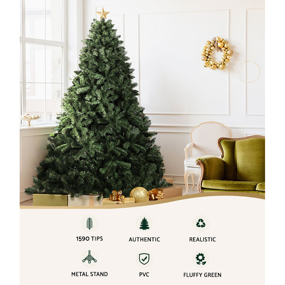 Green artificial Christmas tree in a living room with gold and white ornaments