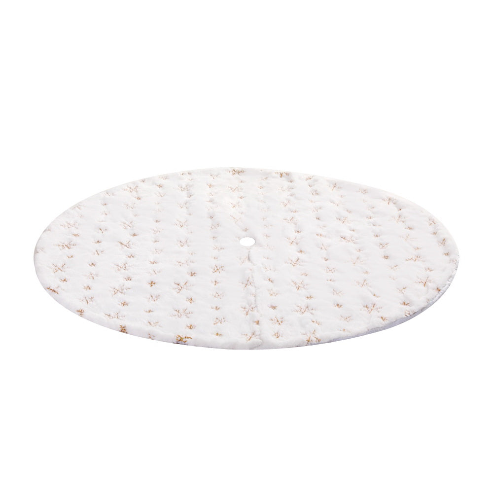 Christmas tree skirt with gold snowflake pattern, shown from the side with round opening