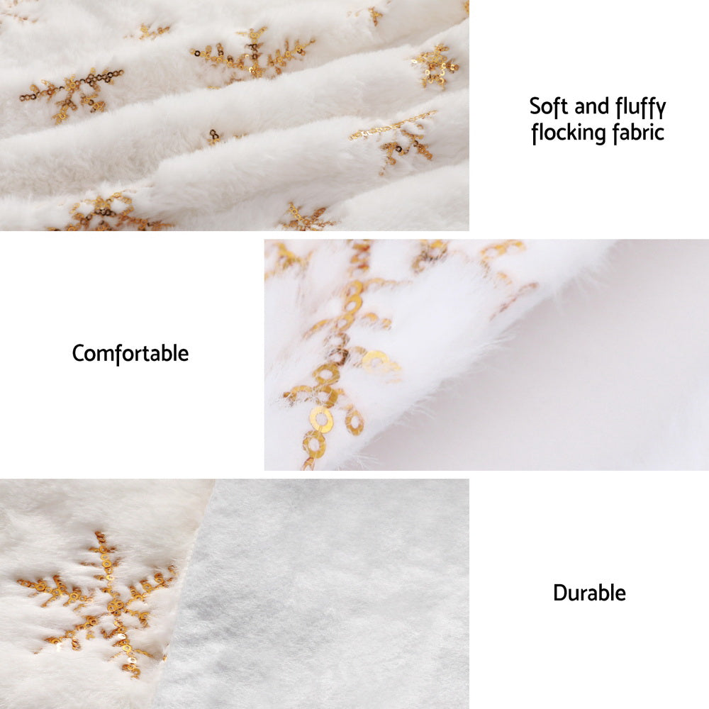 Soft white Christmas tree skirt fabric with gold snowflake pattern and stitched edges