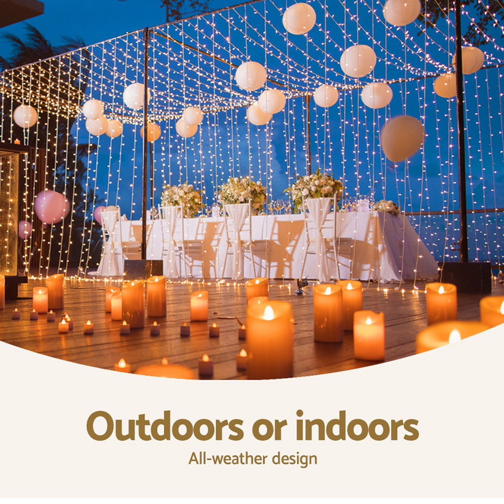 Outdoor or indoor LED curtain lights draped overhead with warm glowing bulbs