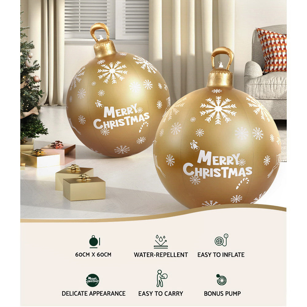 Two gold inflatable Christmas bauble balls with snowflakes and 'Merry Christmas'