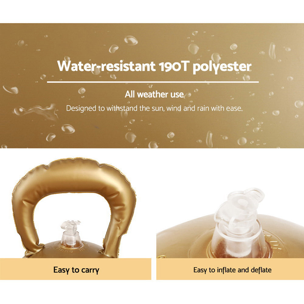 Gold inflatable Christmas bauble ball close-up with carry handle and valve