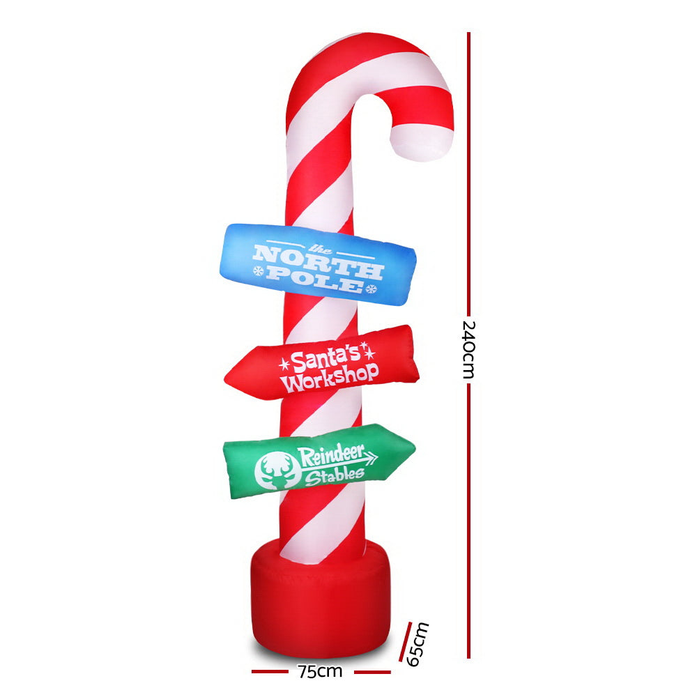 Inflatable candy cane pole decoration with lit sign panels, red base; 2.4 m height.