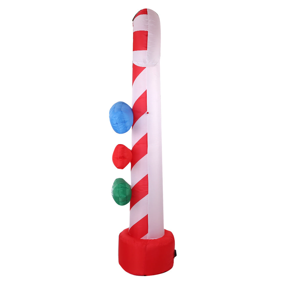 Inflatable candy cane pole with red base and three hanging colored circular markers.