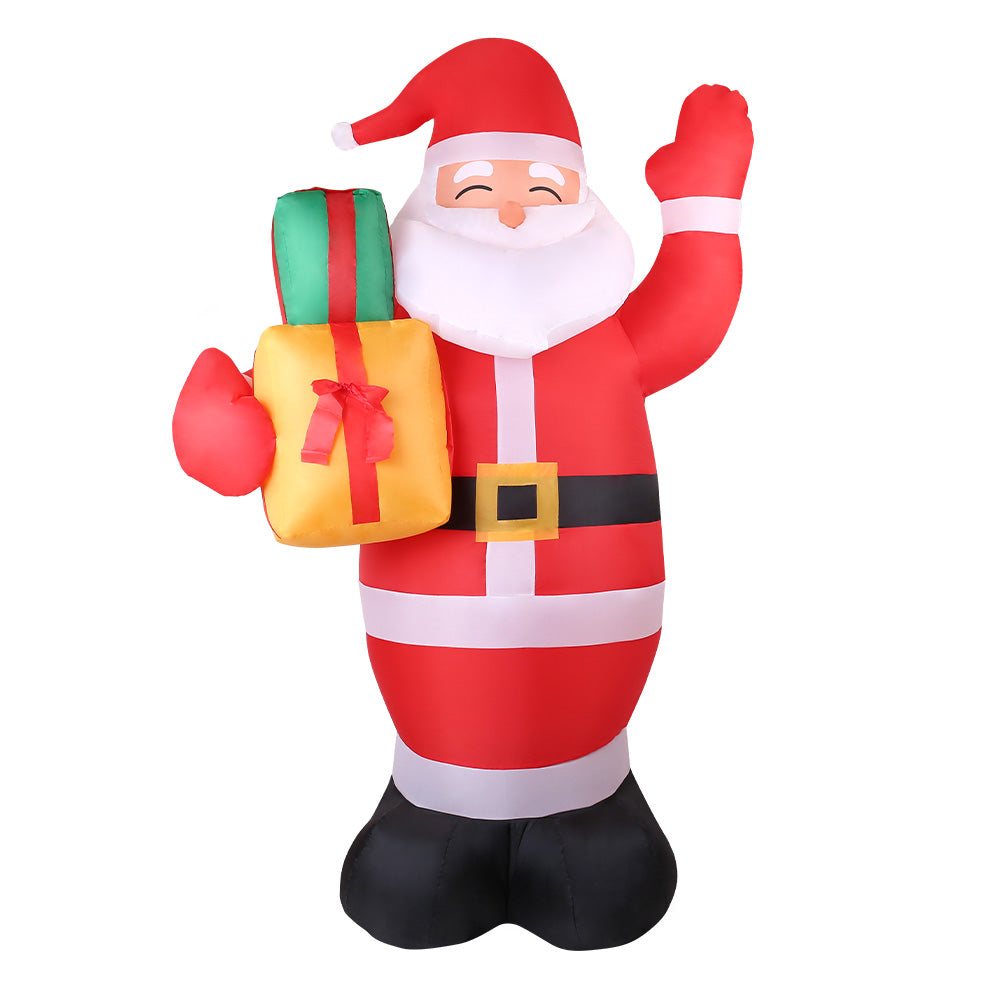 Inflatable Santa decoration with red-and-white striped suit, holding a wrapped gift, black boots