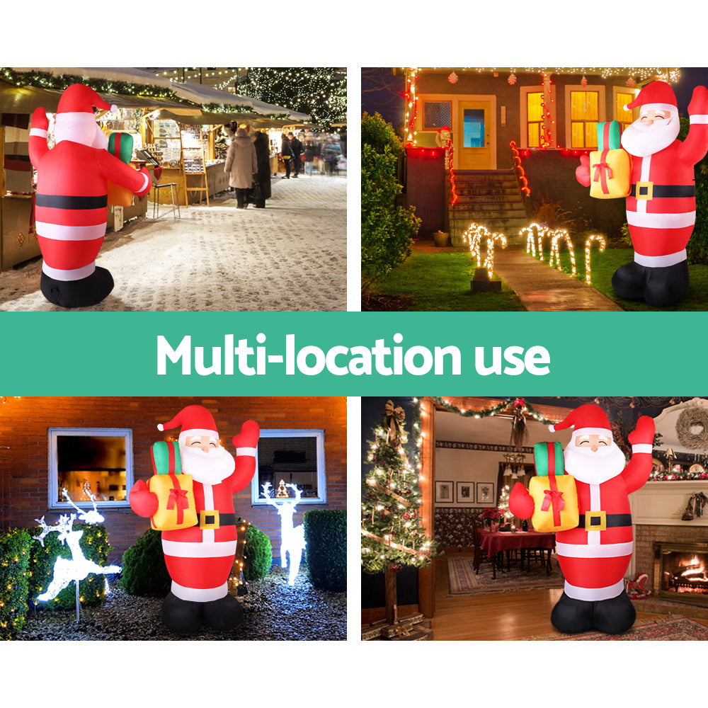 Inflatable Santa decoration with red-and-white striped suit and gift, used for outdoor Christmas