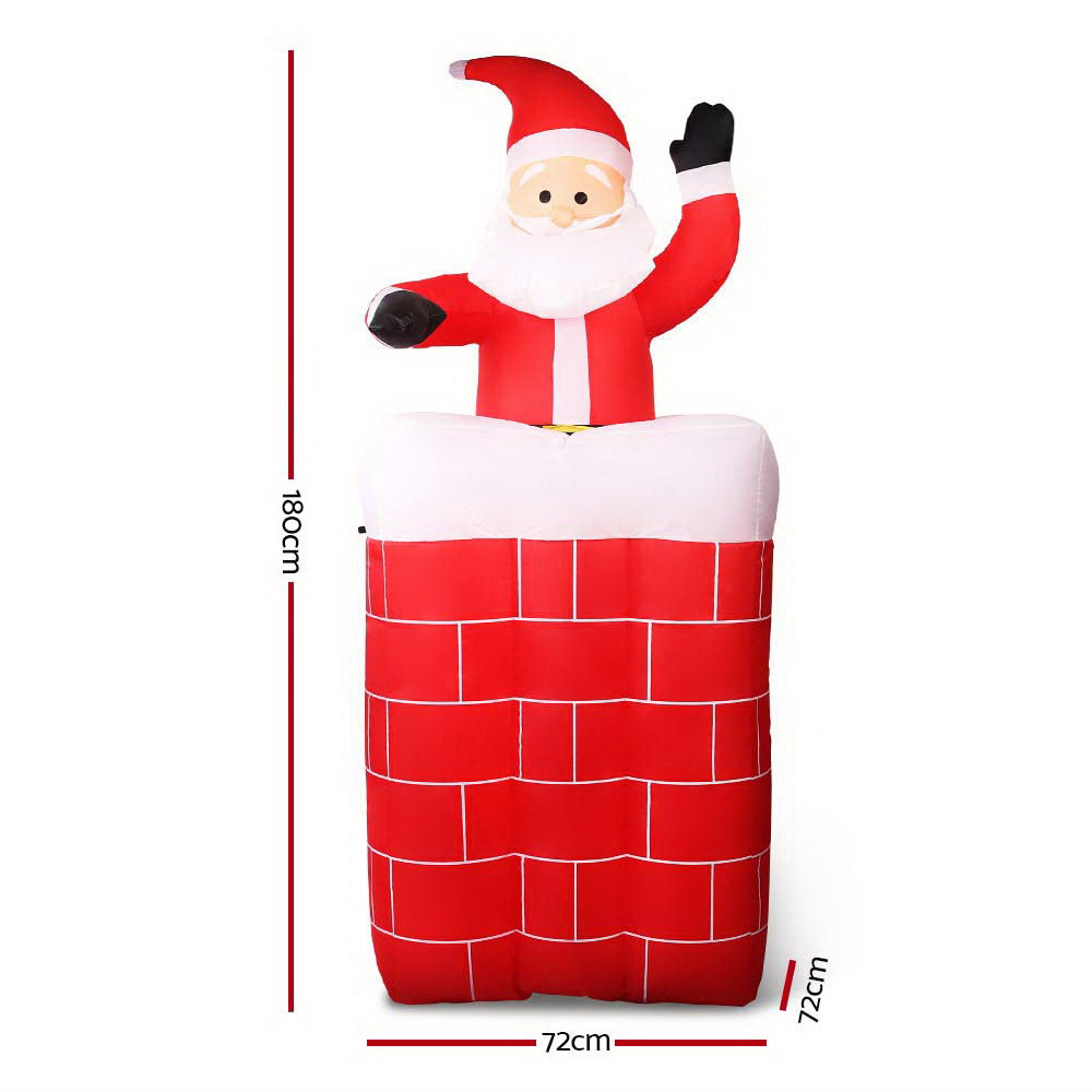 Inflatable Santa pop-up decoration with red suit, white beard, and raised black mitten