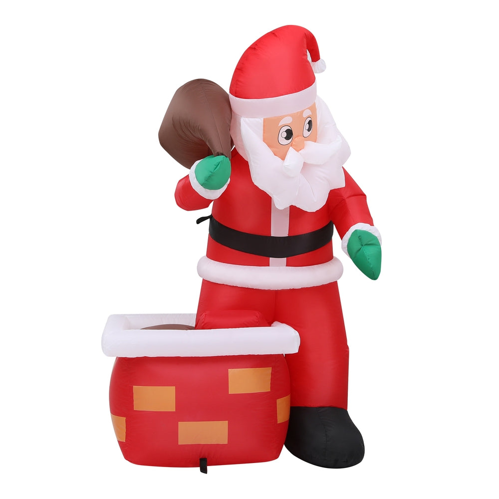 Inflatable Santa yard decoration holding a green bauble, red suit with white beard and hat