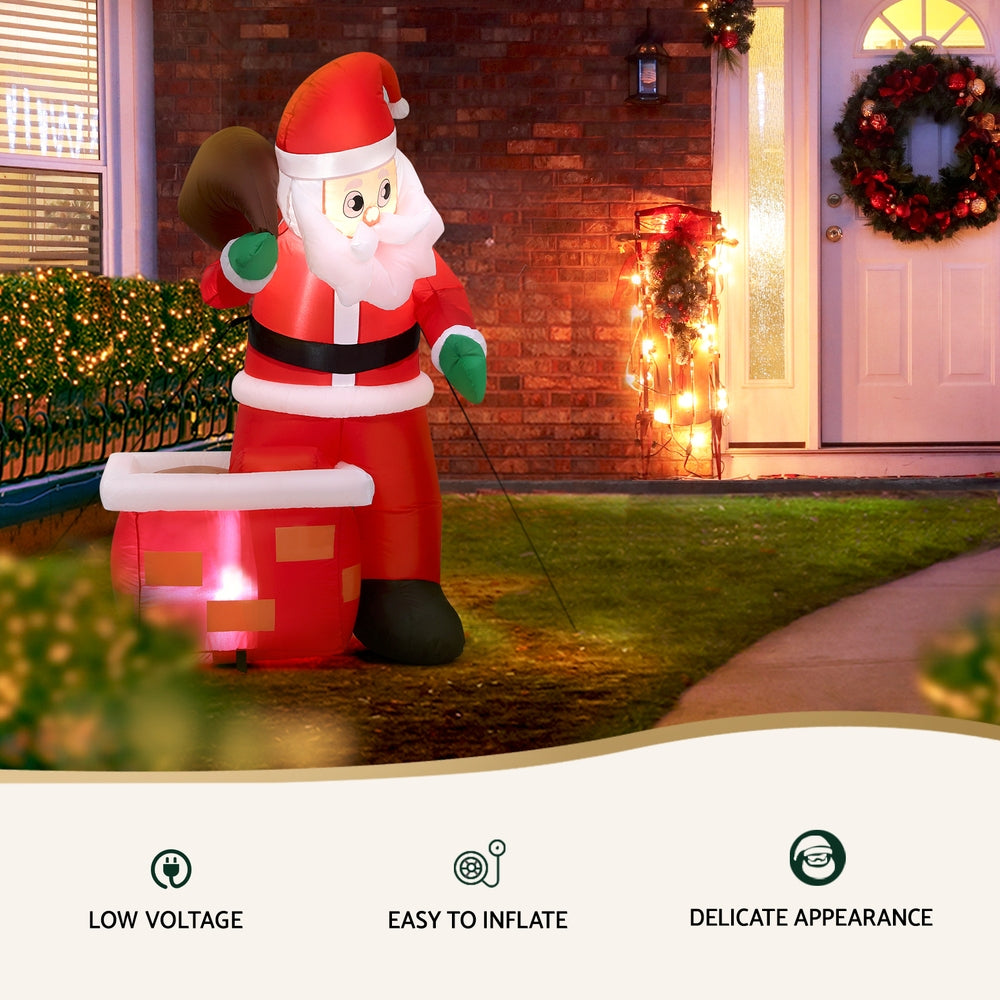 Inflatable Santa yard decoration with glowing lights, red suit, white beard, and red gift box