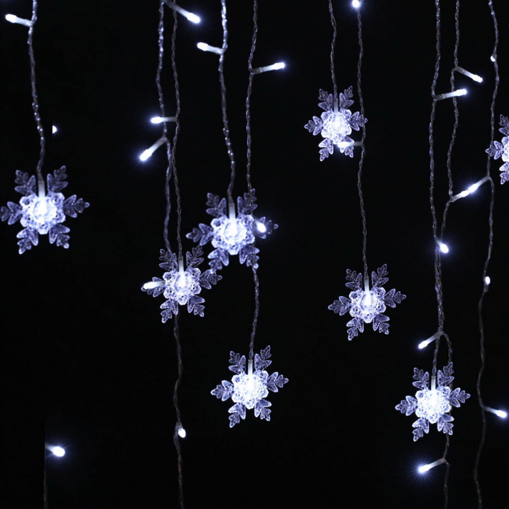 Icicle LED string lights with glowing snowflake star clusters on hanging cords