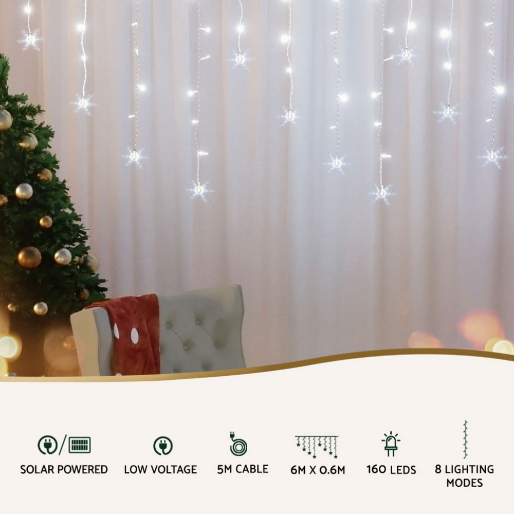 Icicle LED string lights with glowing snowflake star ornaments hanging vertically