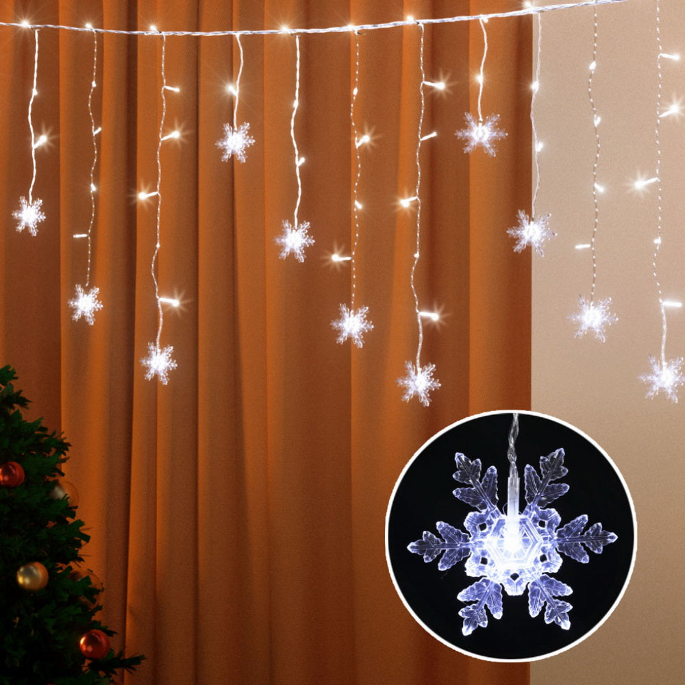 Warm white icicle LED lights with snowflake star bulbs on hanging strands
