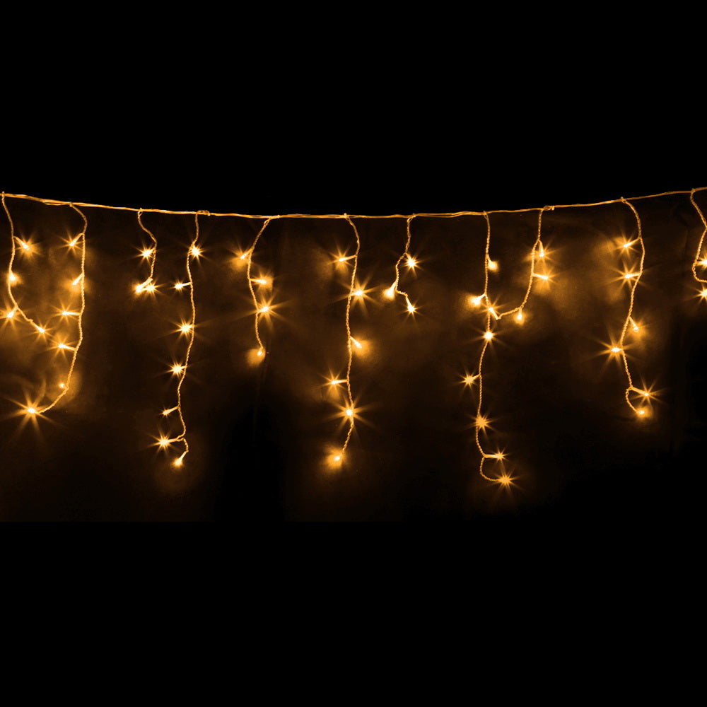 Warm white solar icicle string lights with glowing teardrop LED clusters on a line