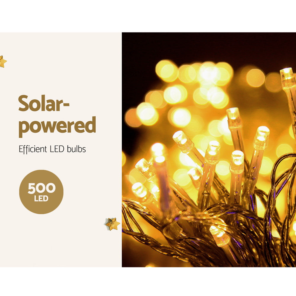 Warm white LED bulbs on solar icicle string light wires, glowing bright in close-up