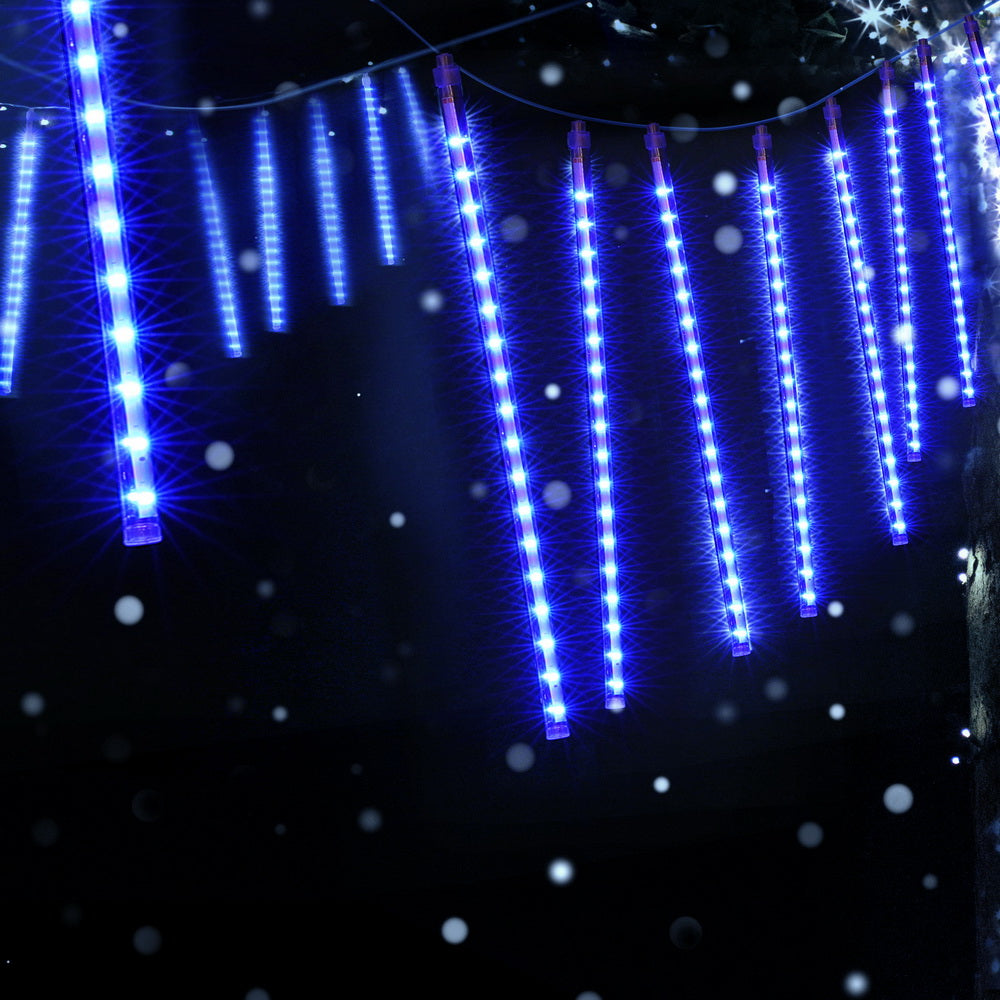 Blue LED icicle string lights with bright vertical glowing strips on a wire