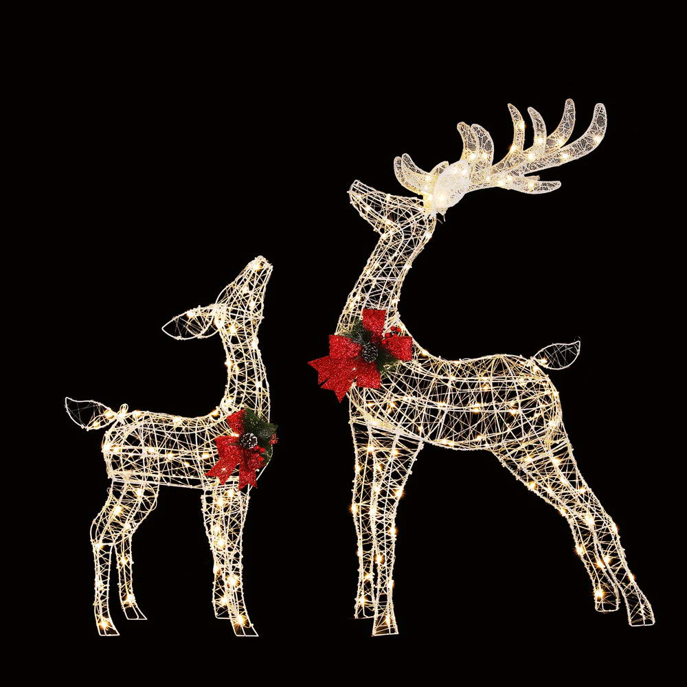 LED reindeer light decorations: two glowing wire reindeer with red bow accents