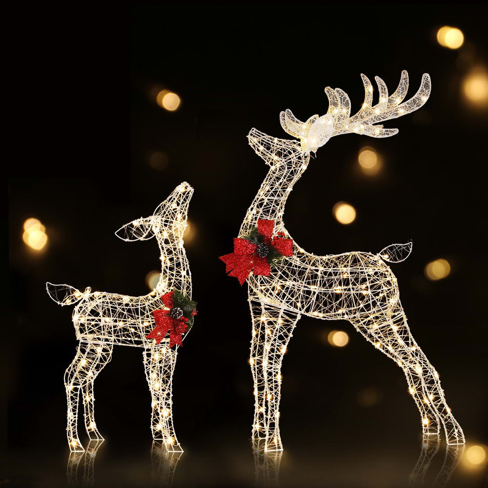 Glowing LED wire reindeer lights with red bow accents, larger reindeer in front